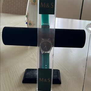 Vintage M &S from London clear face and Dark Green rubber band similar to Swatch